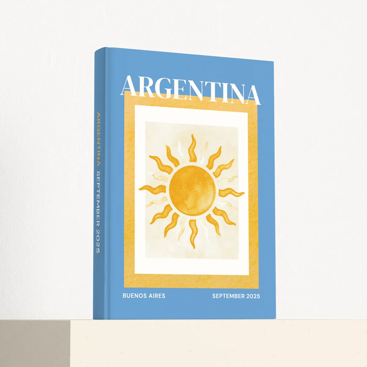 Argentina travel photobook standing at an angle, showing the printed spine and matte hardcover