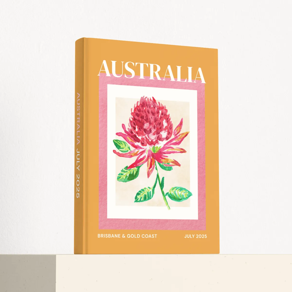 Australia travel photobook standing at an angle, showing the printed spine and matte hardcover