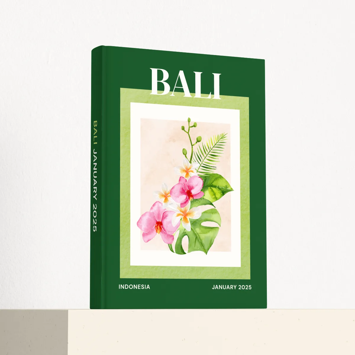 Bali travel photobook standing at an angle, showing the printed spine and matte hardcover