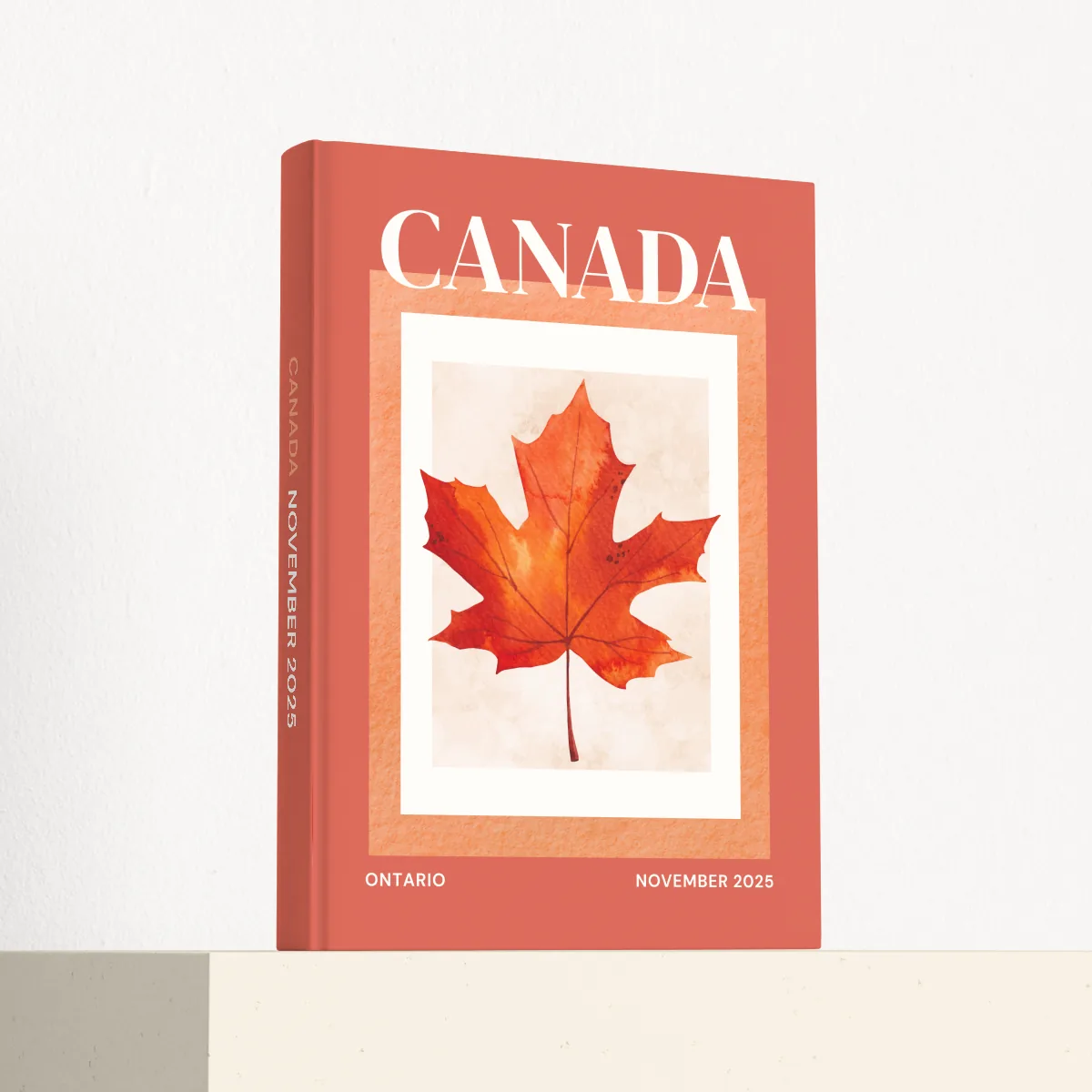 Canada travel photobook standing at an angle, showing the printed spine and matte hardcover