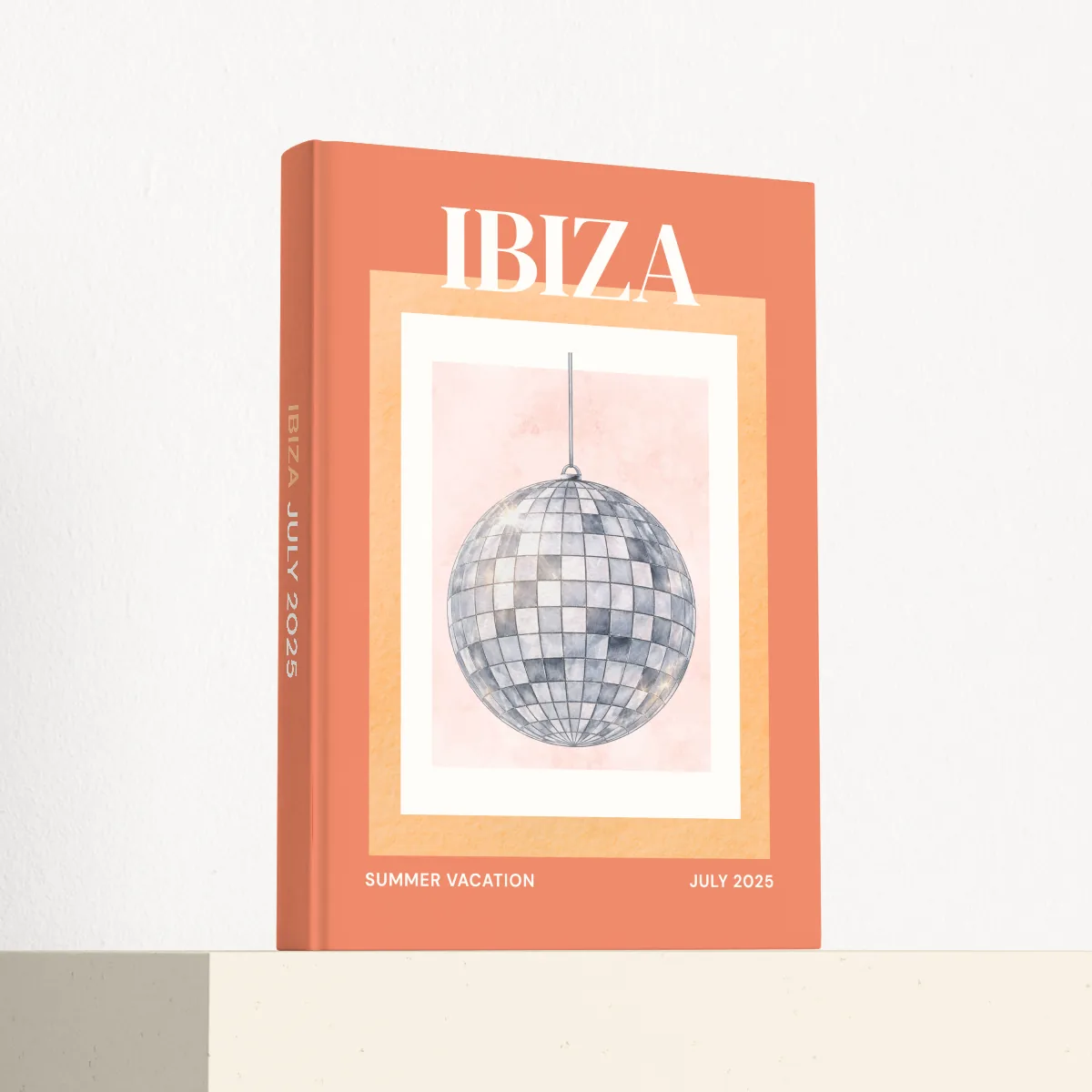 Ibiza travel photobook standing at an angle, showing the printed spine and matte hardcover