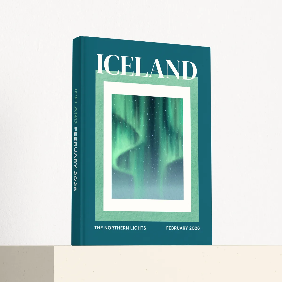 Iceland travel photobook standing at an angle, showing the printed spine and matte hardcover