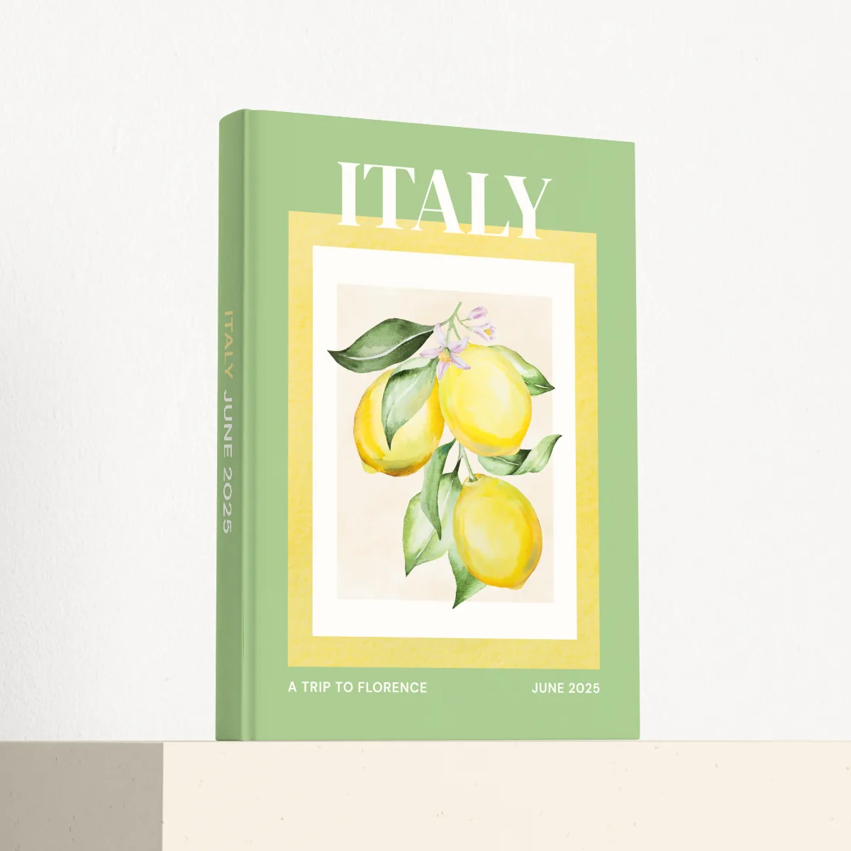 Italy travel photobook standing at an angle, showing the printed spine and matte hardcover