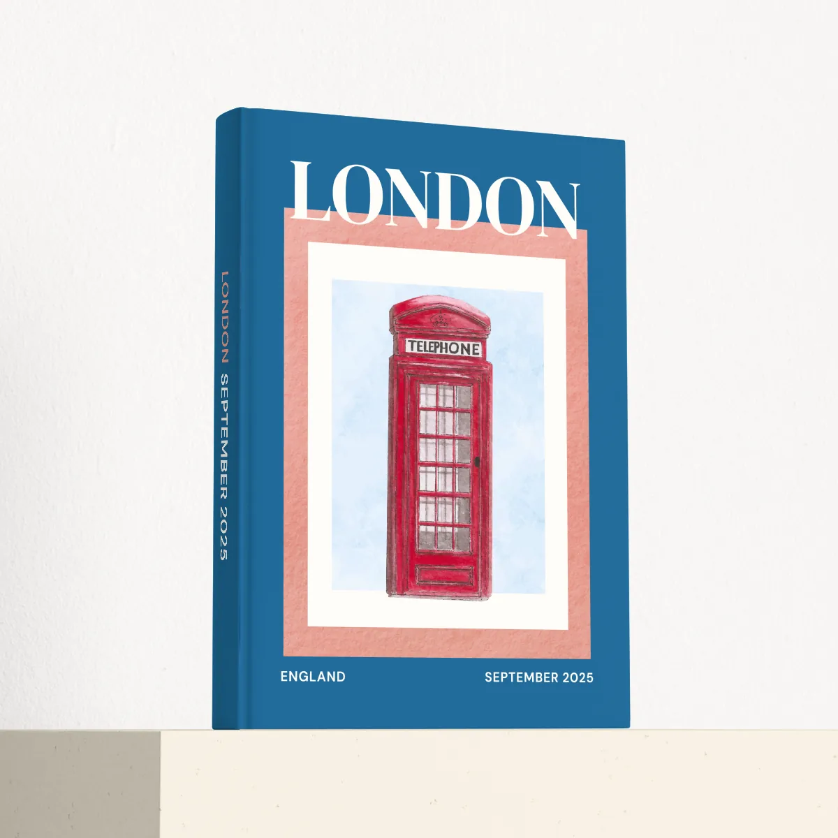 London travel photobook standing at an angle, showing the printed spine and matte hardcover