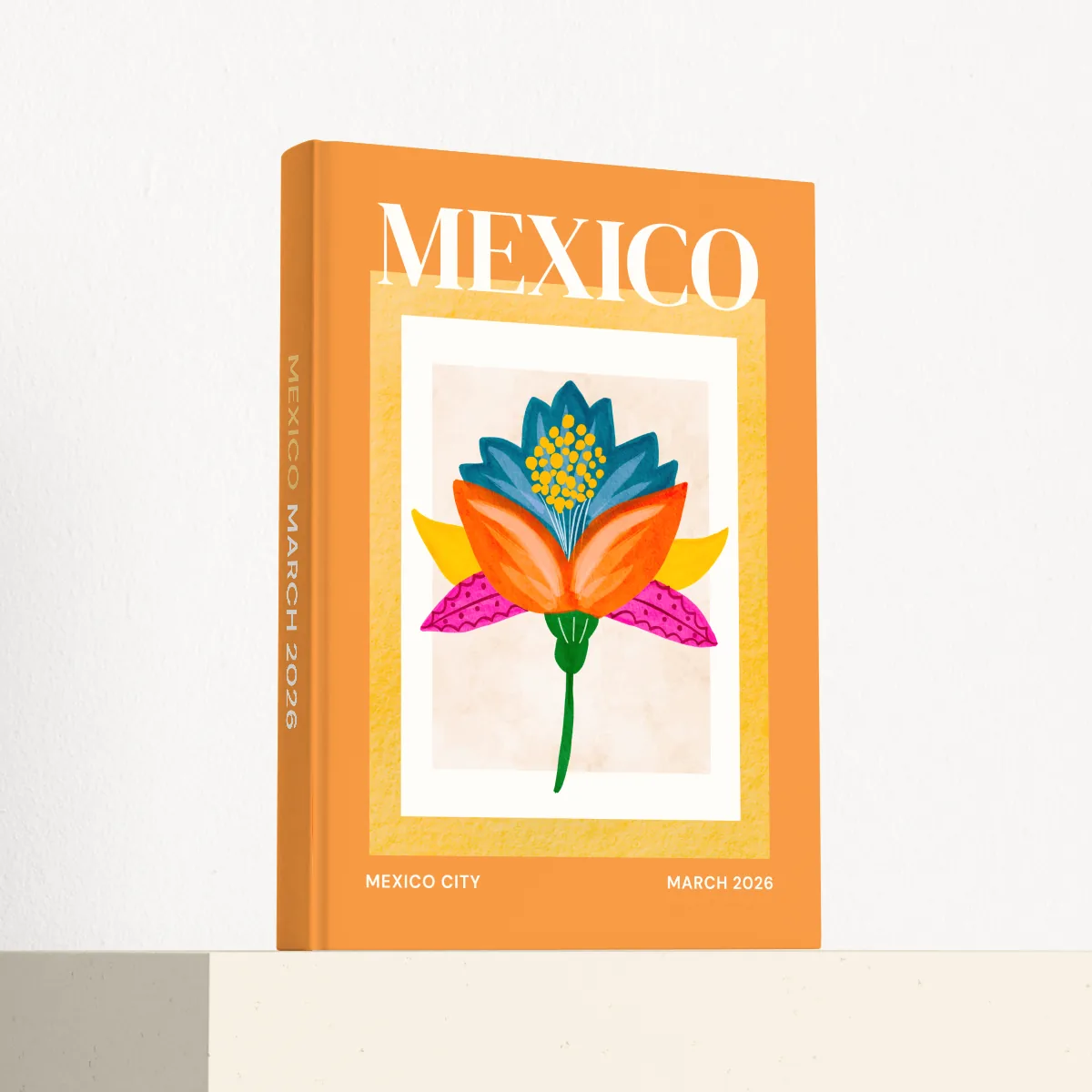 Mexico travel photobook standing at an angle, showing the printed spine and matte hardcover