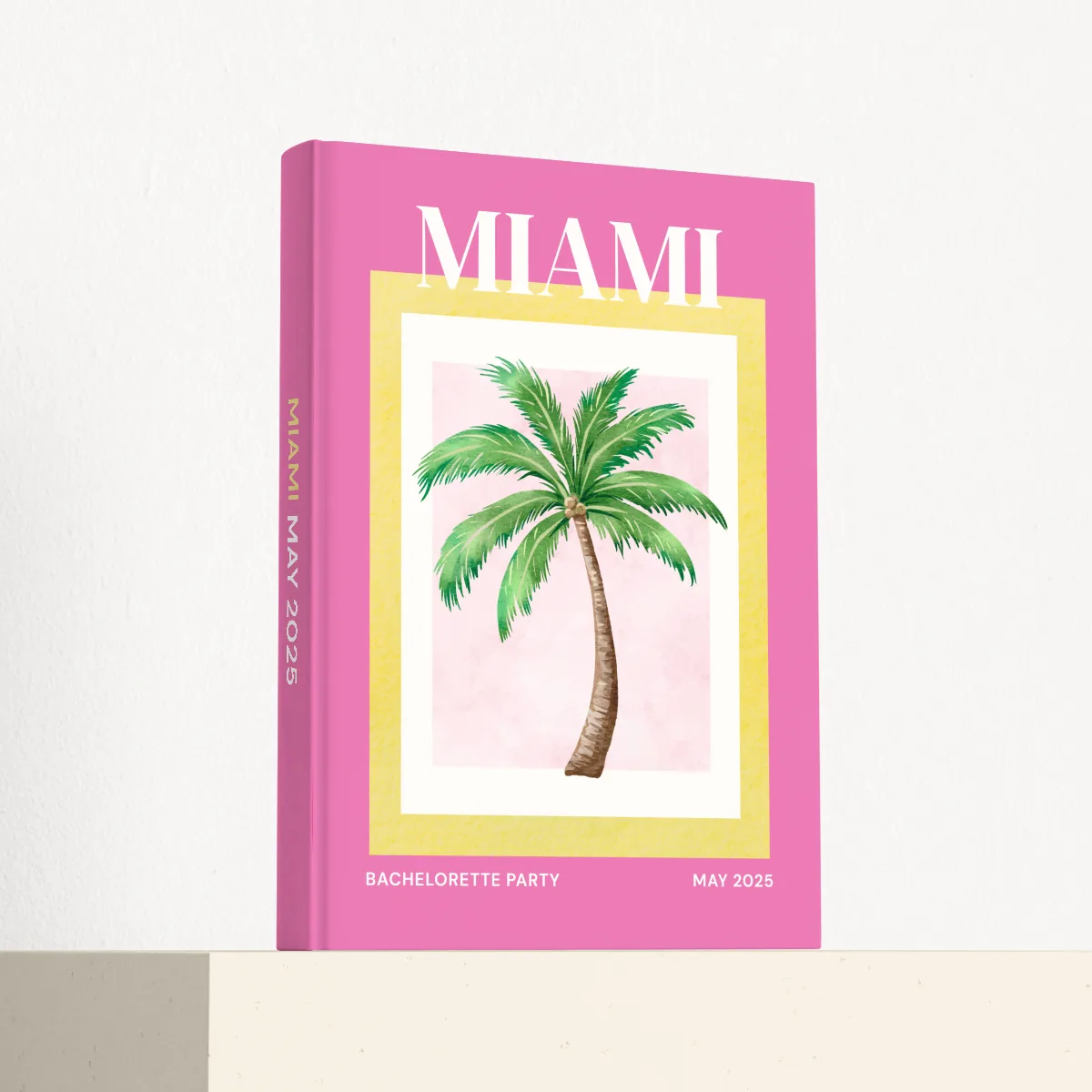 Miami travel photobook standing at an angle, showing the printed spine and matte hardcover