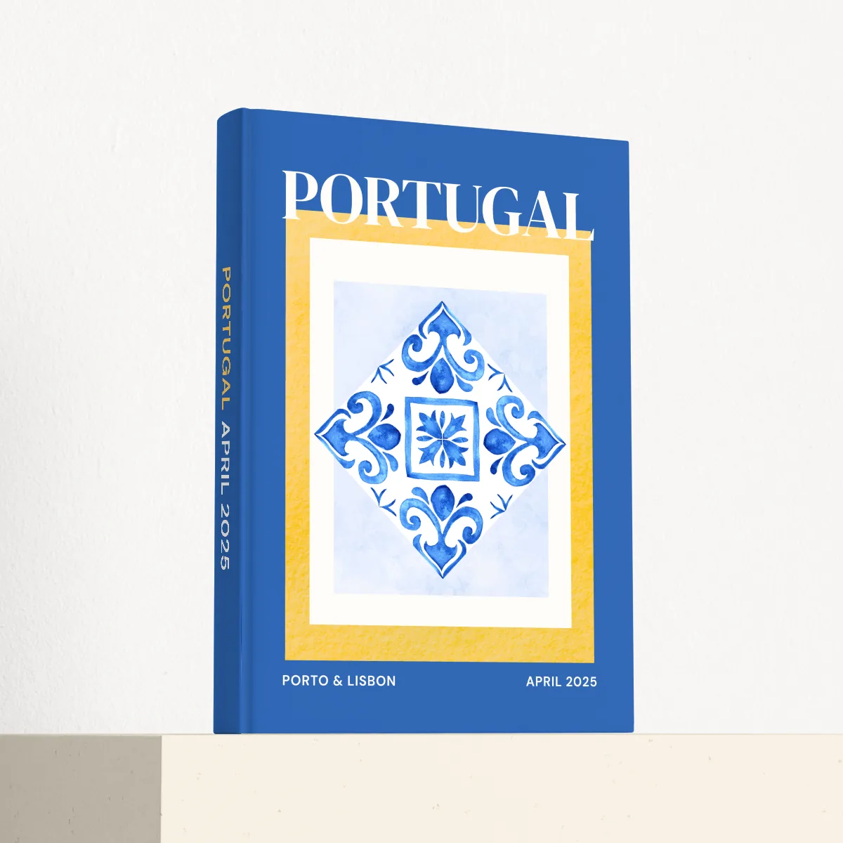 Portugal travel photobook standing at an angle, showing the printed spine and matte hardcover