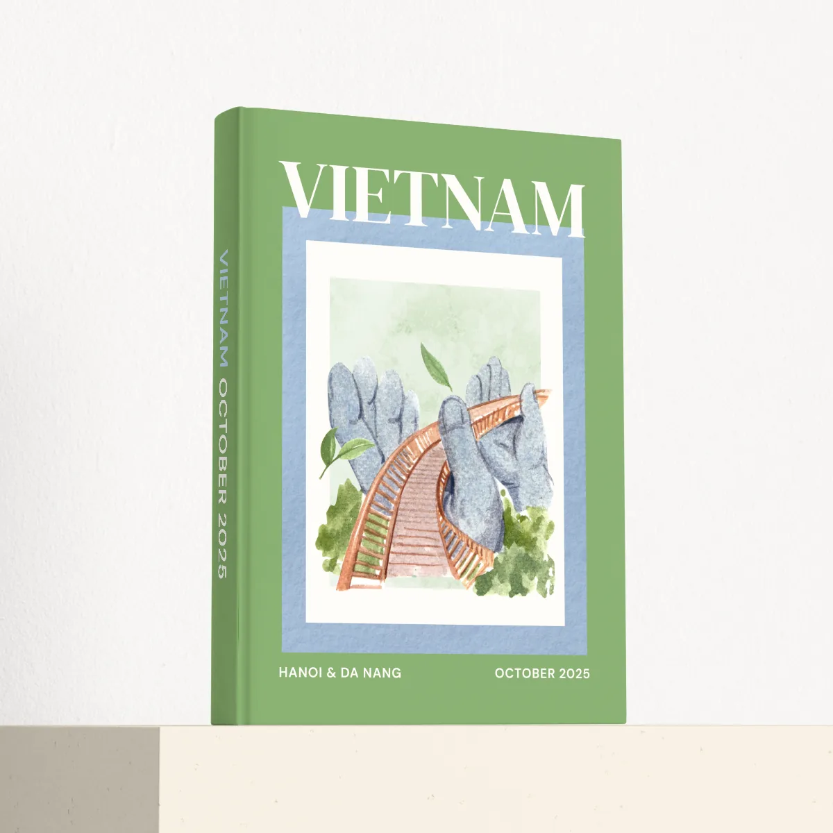Vietnam travel photobook standing at an angle, showing the printed spine and matte hardcover