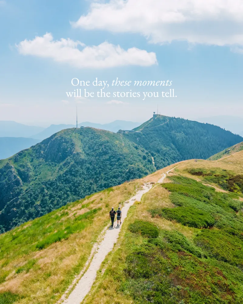 Two hikers on a ridge trail under the line “One day, these moments will be the stories you tell.”